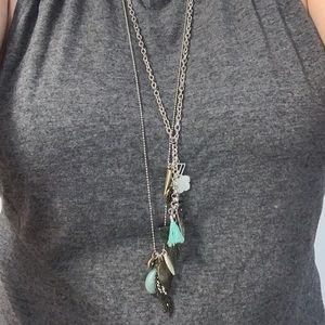 Long silver necklaces with charms